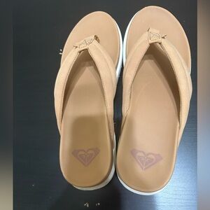 So cute! Roxy platform flip flops. Tan and white. Size 11